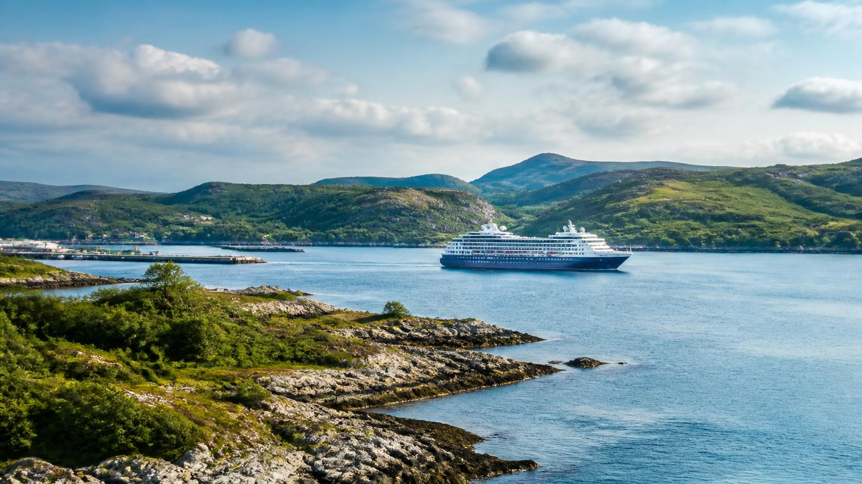 Cruise ship sailing from a Scottish port along the coast of Scotland
